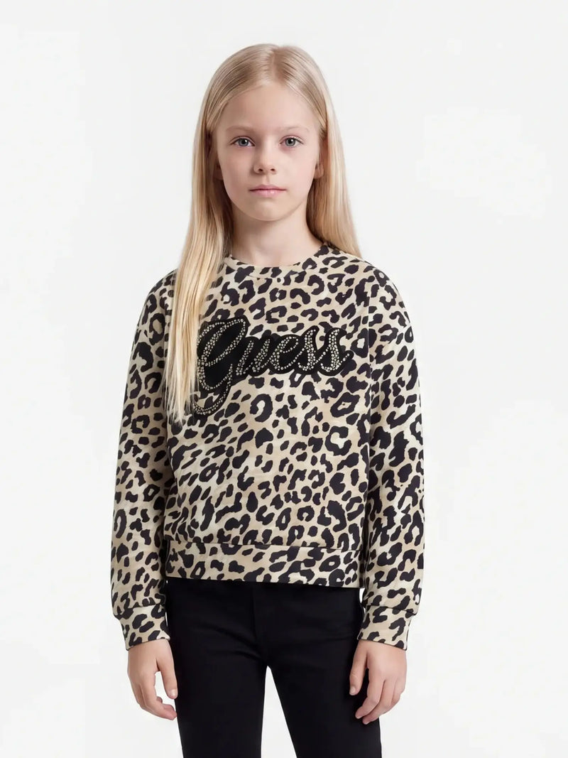 Girl modelling the Guess leopard print sweatshirt.