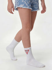 Girl wearing the Guess logo socks.