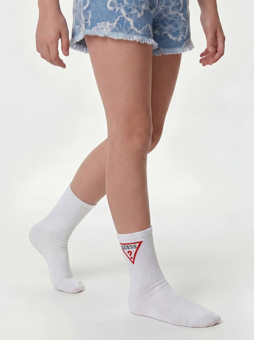 Girl wearing the Guess logo socks.
