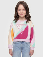 Girl modelling the Guess patterned sweatshirt.
