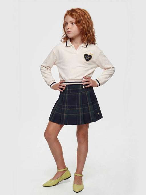 Girl modelling the Guess plaid skirt set.