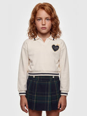 Closer view of the Guess plaid skirt set.