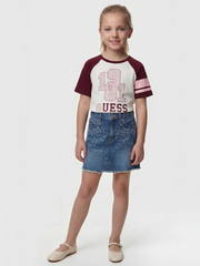 Smiling Girl modelling the Guess raglan t-shirt.