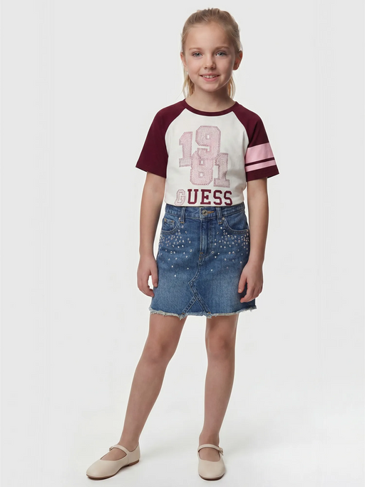 Smiling Girl modelling the Guess raglan t-shirt.