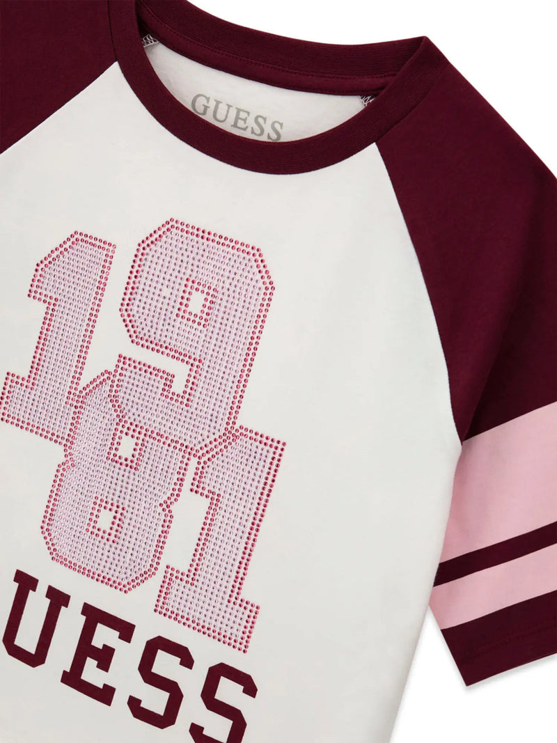 Closer look at the Guess raglan t-shirt showing detail of the pink rhinestone logo.