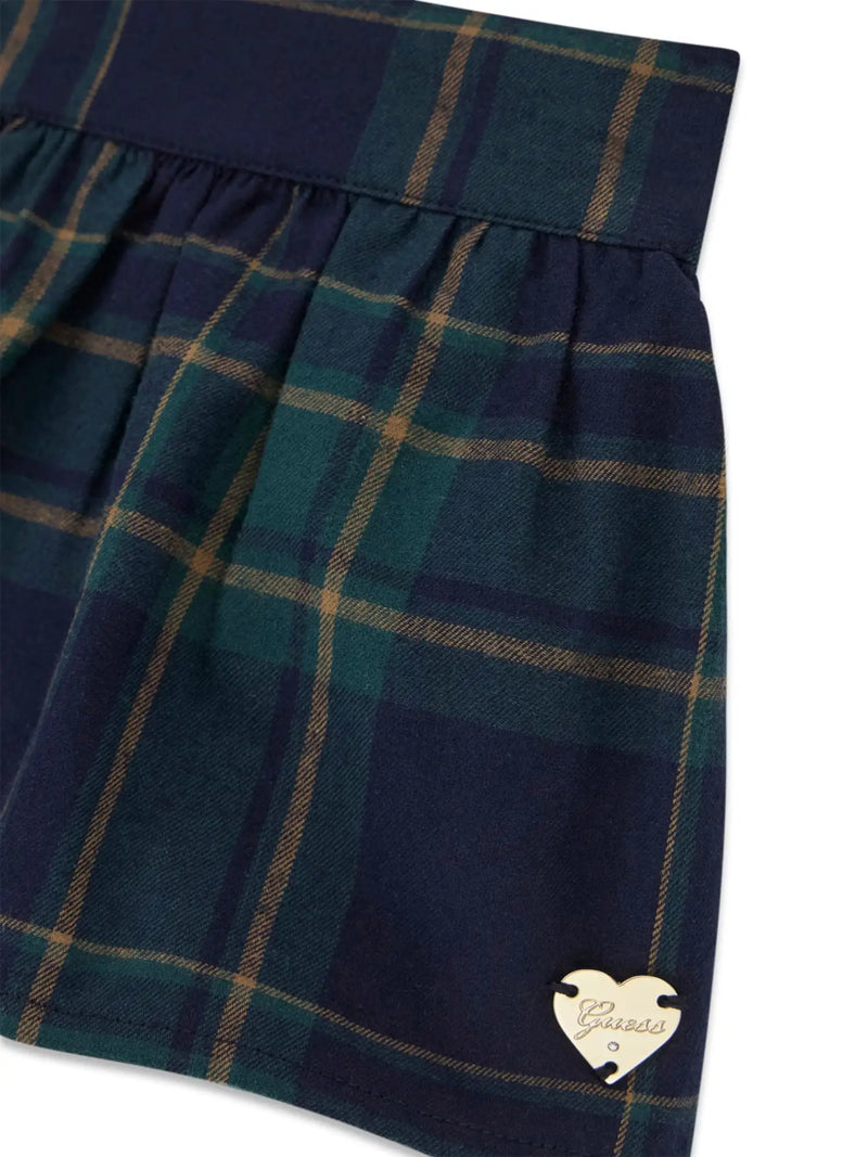 Guess plaid skirt with gold heart logo badge.