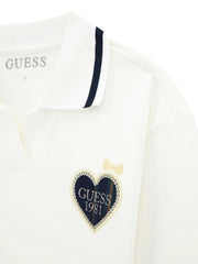 Closer look at the white top showing detail of the plaid heart logo.