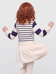 Girl wearing the Guess striped polo dress.
