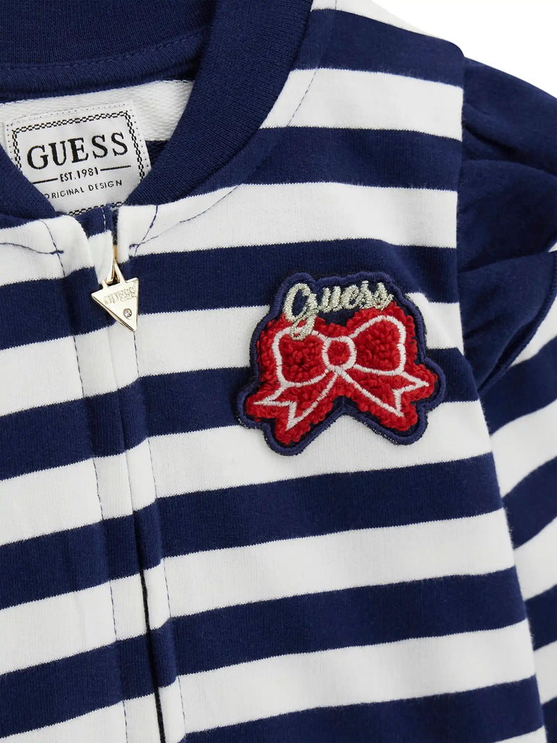 Closer look at the Guess striped sweatshirt showing detail of the red bow appliqué.