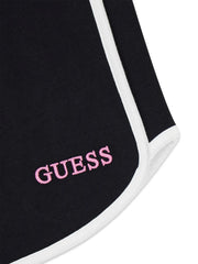 Closer look at the Guess track shorts showing detail of the contrasting white trim.