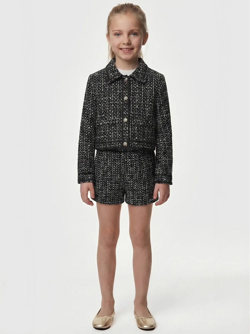 Smiling Girl modelling the Guess tweed shorts.