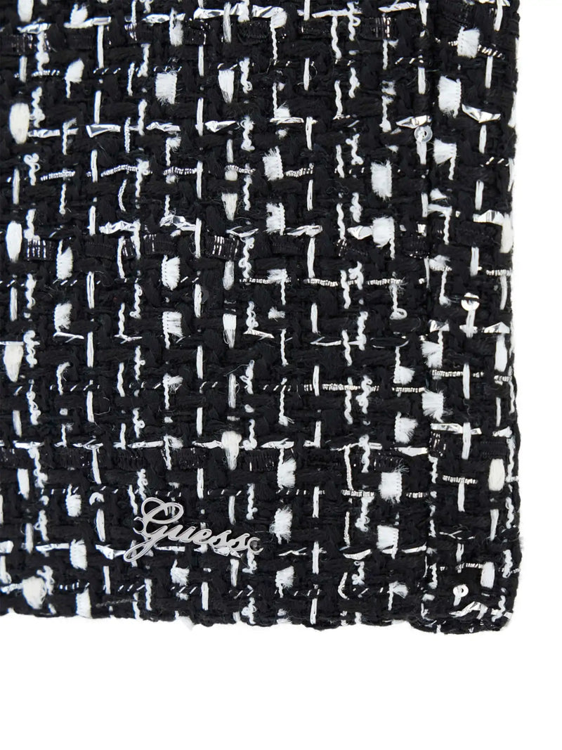 Girl's black tweed shorts with Guess logo badge at the hem.