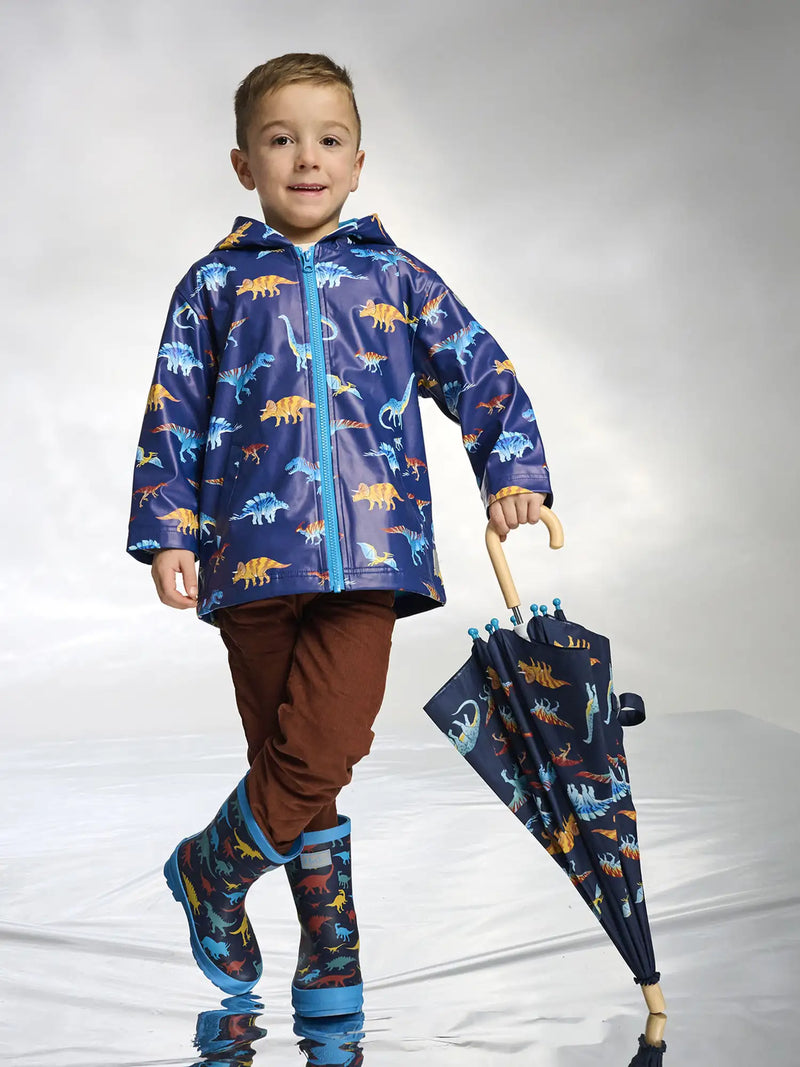 Boy wearing the Hatley colourful dinos raincoat.