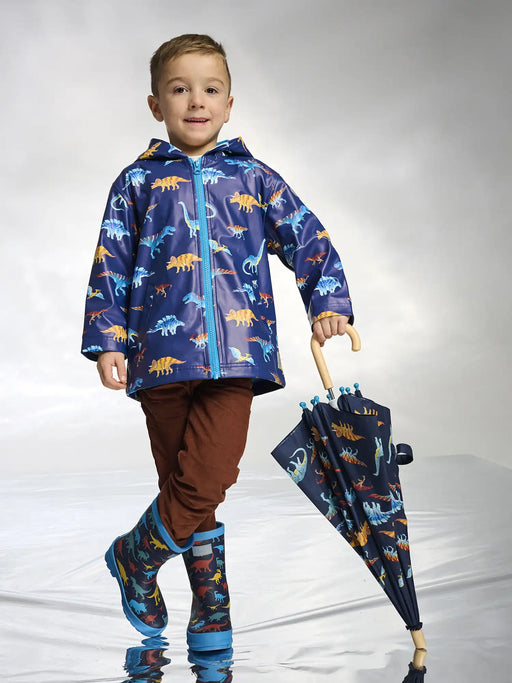 Boy wearing the Hatley colourful dinos raincoat.