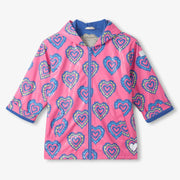 Girl's pink raincoat with colour changing pattern. 