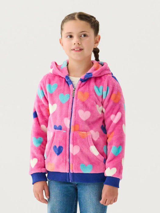 Smiling girl modelling the Hatley hearts zip up hoodie.