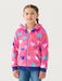 Smiling girl modelling the Hatley hearts zip up hoodie.