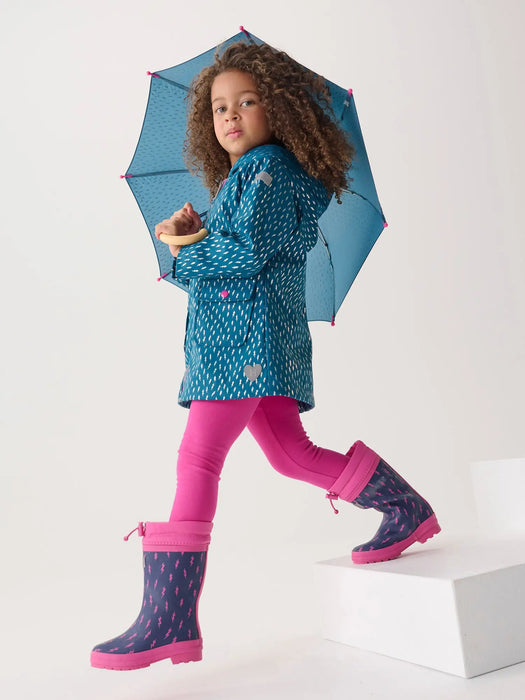 Girl wearing the Hatley lightning bolts raincoat.