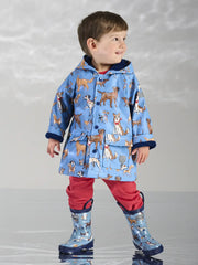 Smiling Boy modelling the Hatley little pups raincoat.