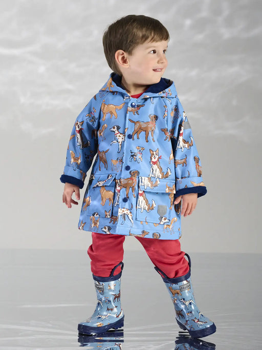 Smiling Boy modelling the Hatley little pups raincoat.