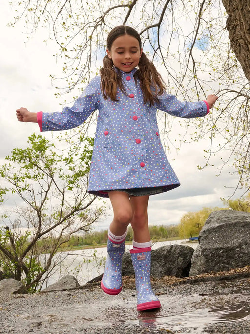 Girl wearing the Hatley lots of dots jacket.