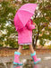 Girl wearing the Hatley rain drops colour changing raincoat.