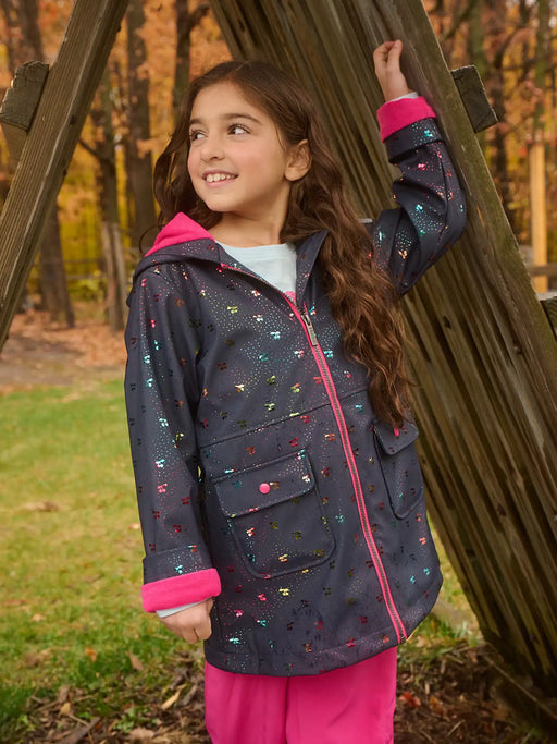 Hatley navy rainbow cherry raincoat, modelled by girl.