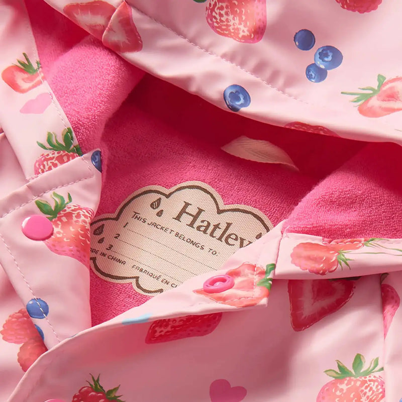 Closer look at the Hatley summer berries raincoat showing detail of the pink inner lining.