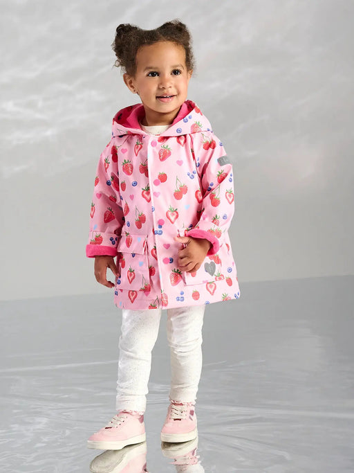 Girl wearing the Hatley summer berries raincoat.