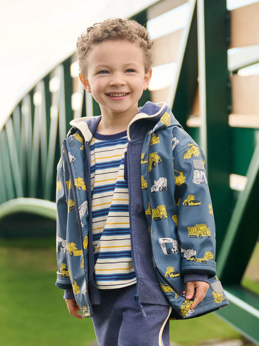 Boy wearing the Hatley under construction raincoat.