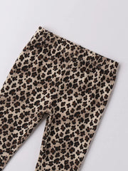 Closer look at the iDo girl's leggings showing detail of the leopard print pattern.