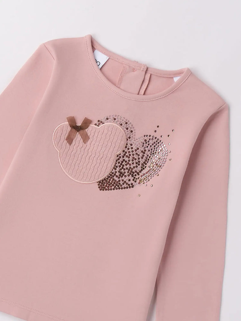 Closer look at the pink t-shirt with sequin heart design.