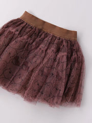Closer view of the dusky pink tulle skirt.