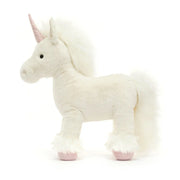 Side view of the Jellycat isadora unicorn.