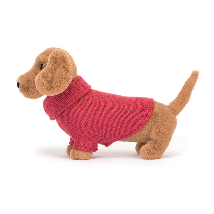 Side view of the Jellycat sweater sausage dog.