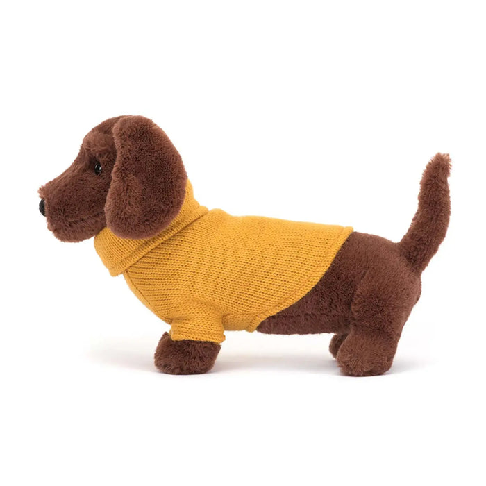 Side view of the Jellycat sweater sausage dog.