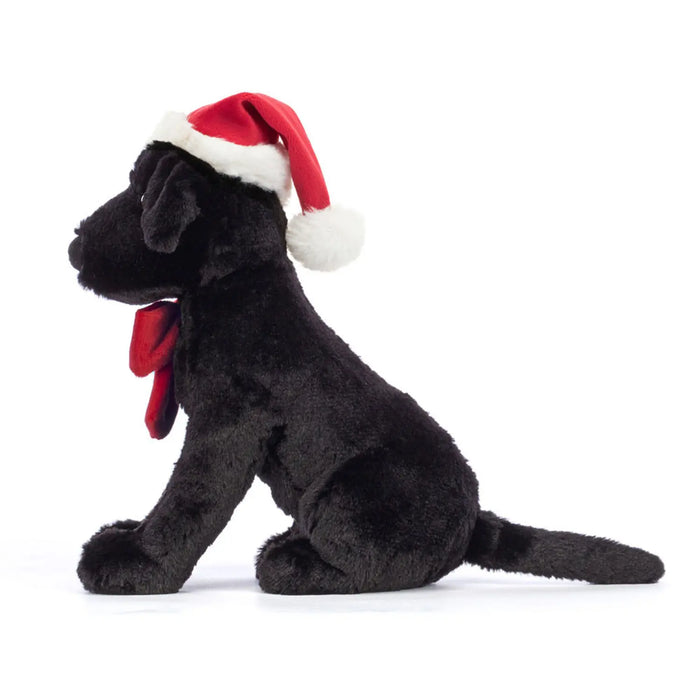 Side view of the Jellycat winter warmer pippa labrador.