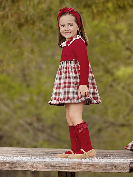 Smiling girl modelling the Juliana dress & bonnet.