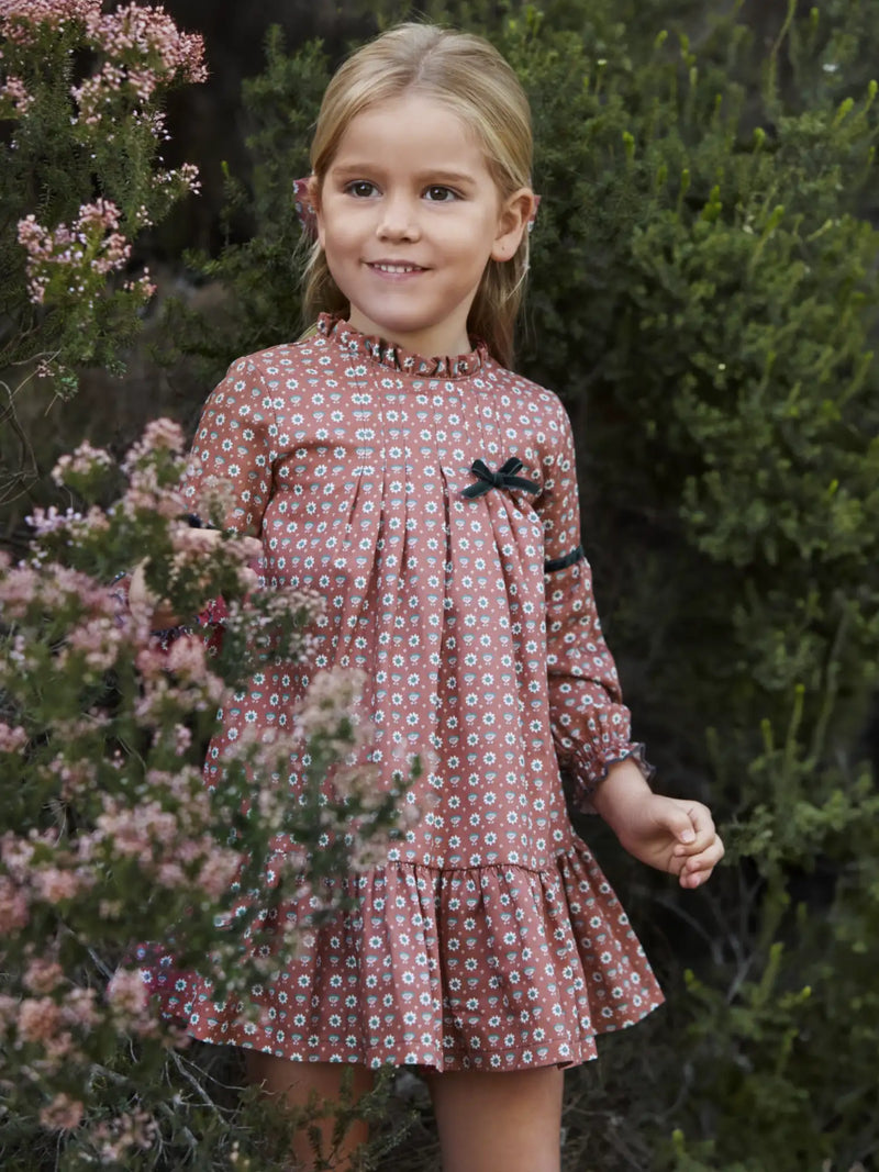 Smiling Girl modelling the Juliana floral print dress.