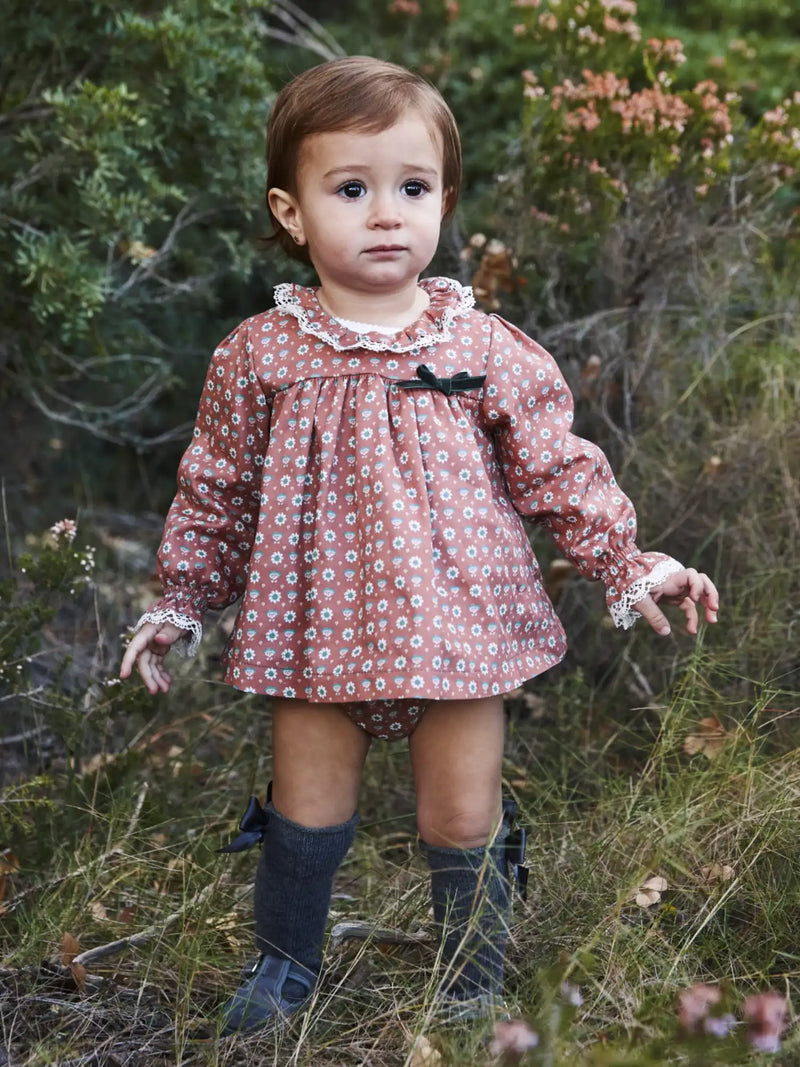 Baby girl wearing the Juliana floral print dress.
