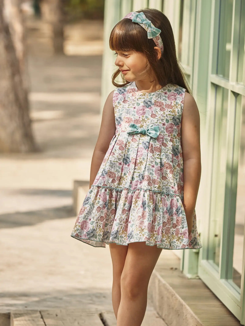 Baby girl wearing the Juliana floral print frilled dress.