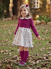 Girl wearing the Juliana knitted dress.