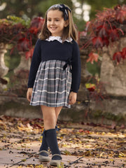 Girl wearing the Juliana knitted dress.