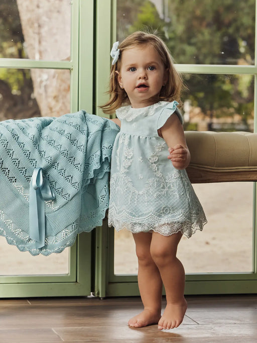 Baby girl modelling the Juliana lace dress.