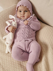 Baby girl wearing the Juliana leg warmer set.