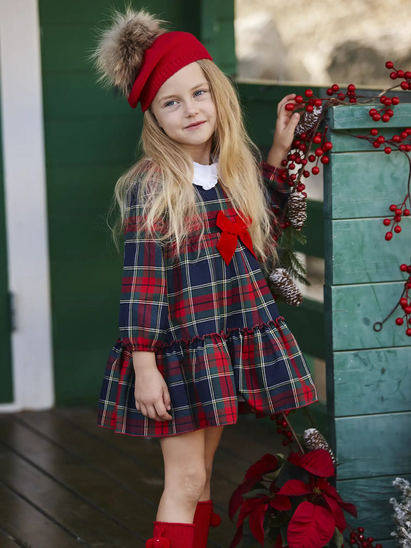 Smiling girl modelling the Juliana plaid dress.