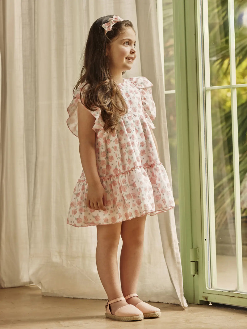 Baby girl wearing the Juliana rose print dress.