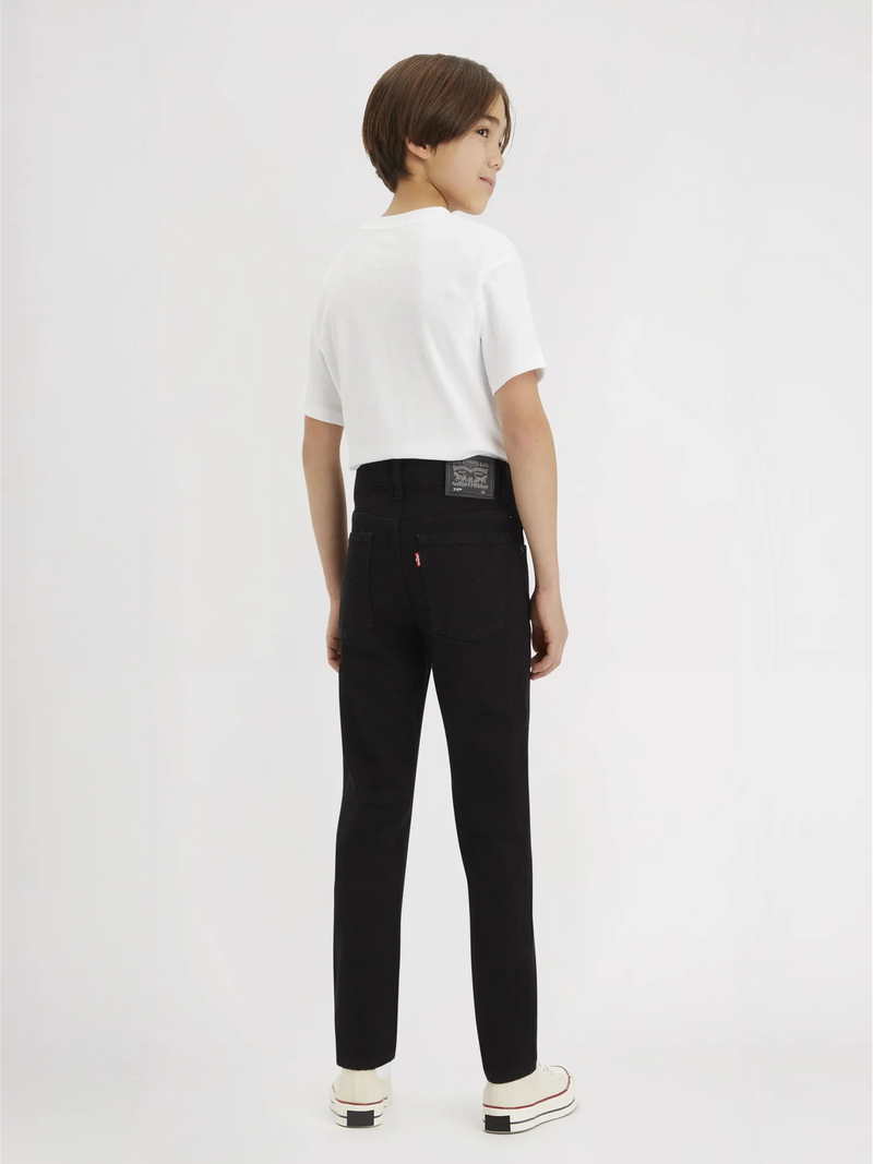 Boy modelling the Levi's 510 skinny fit jeans.