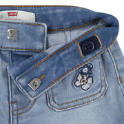 Closer look at the Levi's denim shorts showing detail of the flower embroidery.