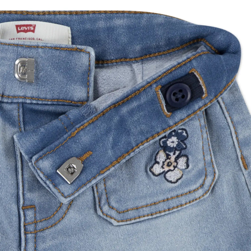 Closer look at the Levi's denim shorts showing detail of the flower embroidery.